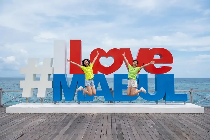 Famous photo spot at the I Love Mabul sign on Mabul Island Pearl Island Resort