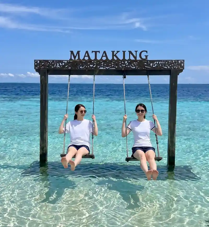 Visiting the sandy shores of Mataking Island with Pearl Island Resort near the Tun Sakaran Marine Park.