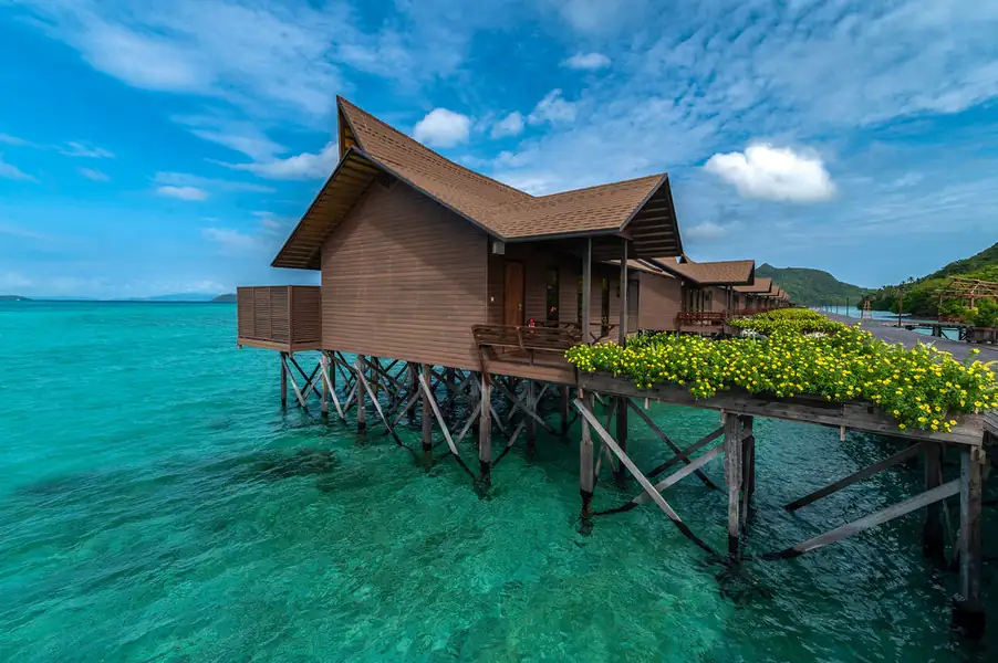 Scenic view of the overwater wooden chalets Pearl Island Resort